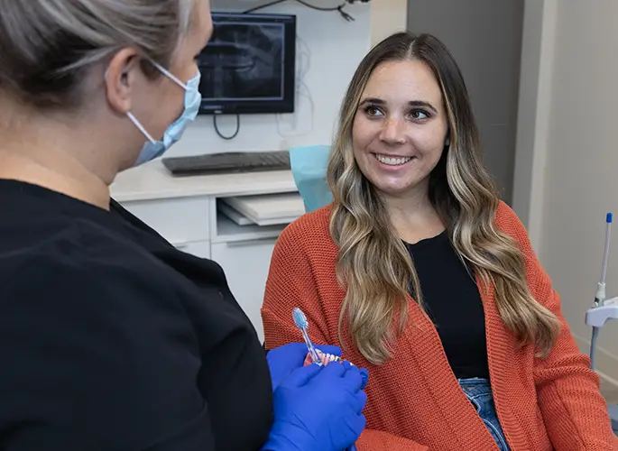 Consulting with dental patient